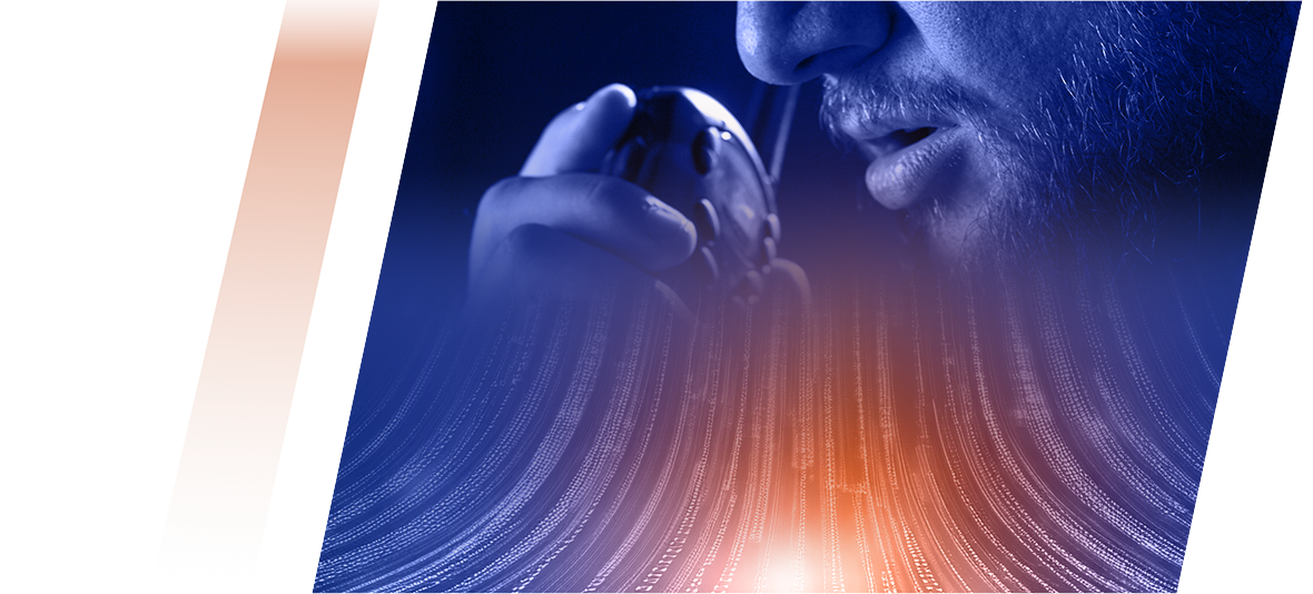 Close-up of a person with a beard speaking into a microphone, set against blue and orange abstract light waves.