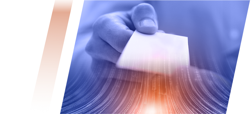 Hand holding a white card about to be inserted into a reader, with an orange and blue abstract background.
